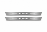 Product visualization: two flat long front plates with original squared FUSION lettering, side bars and Stainless edge LEDs; outline checked against saved exact material pair flat brushed stainless steel door sill plates with white LED artwork and edges, white background.