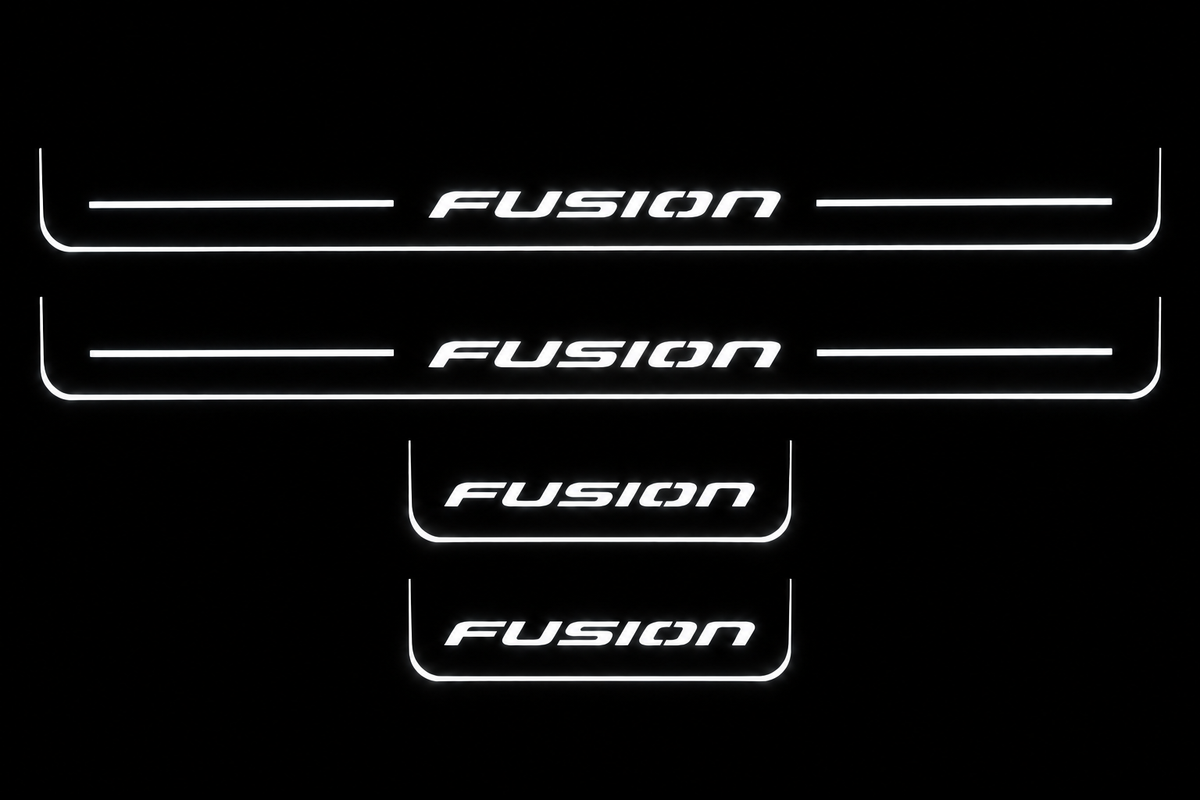 Product visualization: four original flat Fusion sill plates, two front with bars and two shorter rear without bars; white illumination flat brushed stainless steel door sill plates with white LED artwork and edges, dark background.