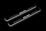 Product visualization: Ford Kuga logo, two exact matching source plates flat brushed stainless steel door sill plates with white LED artwork and edges, dark background.