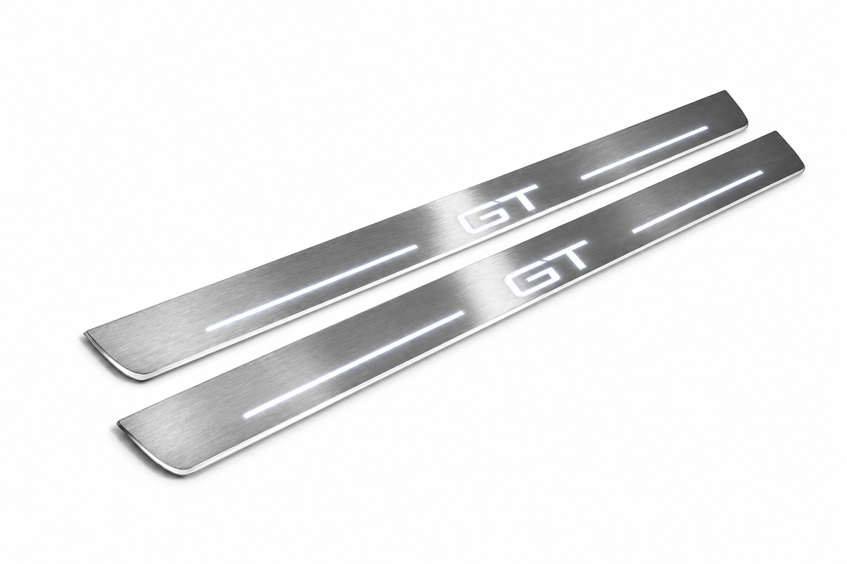 Product visualization: two exact original mach-e-gt-diagonal flat Stainless front plates; all source artwork retained and actual LED edges white flat brushed stainless steel door sill plates with white LED artwork and edges, white background.