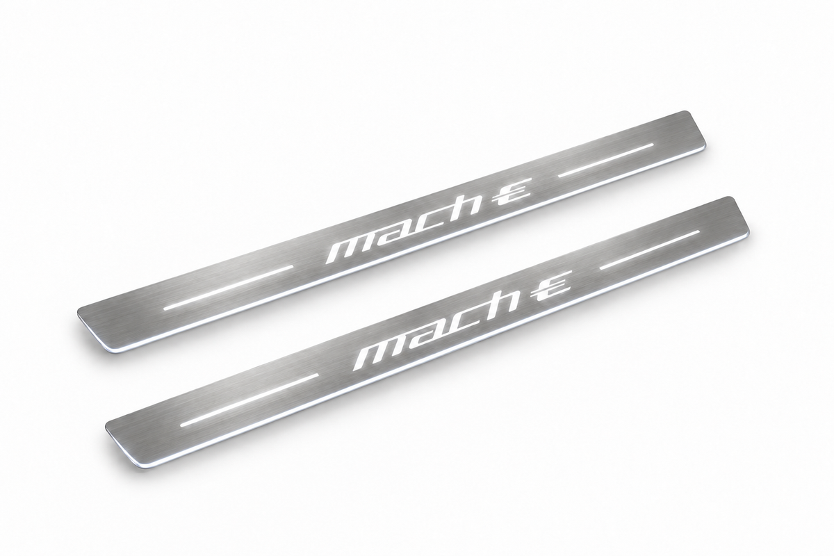 Product visualization: two exact original mach-e-logo-diagonal flat Stainless front plates; all source artwork retained and actual LED edges white flat brushed stainless steel door sill plates with white LED artwork and edges, white background.