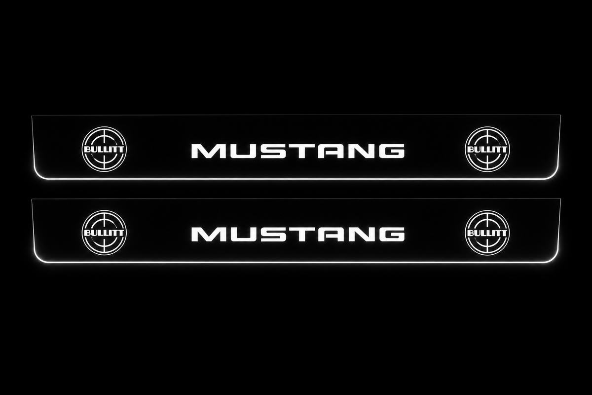 Product visualization: two flat mustang-bullitt-targets Stainless front plates with original source lettering and white LED zones flat brushed stainless steel door sill plates with white LED artwork and edges, dark background.