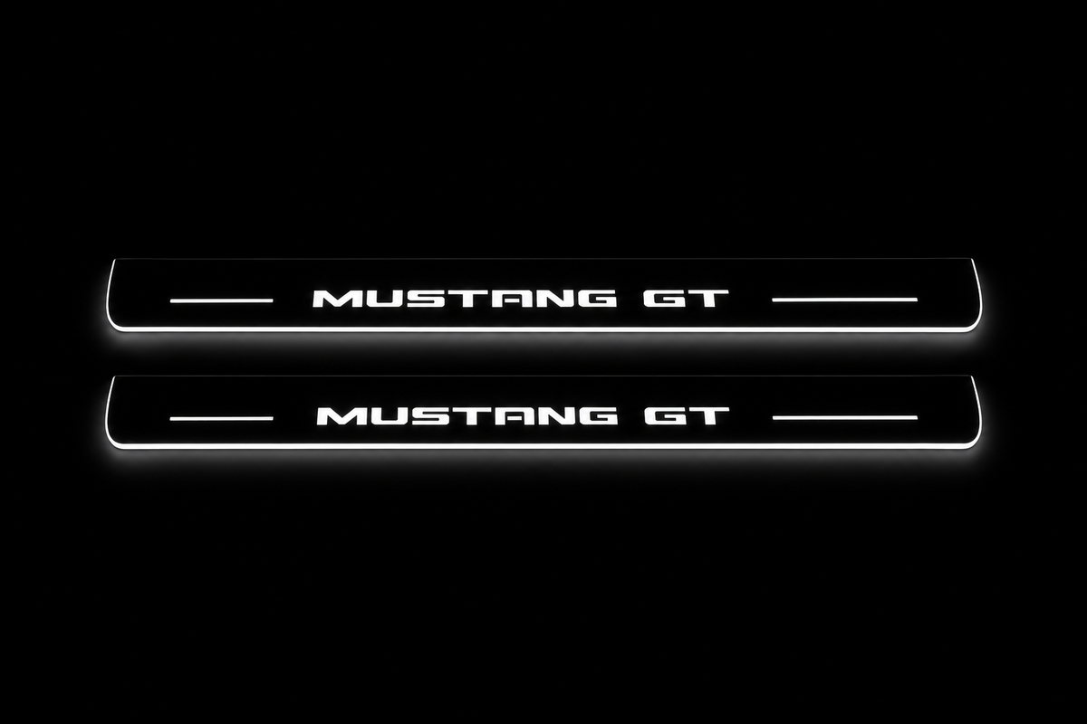 Product visualization: mustang-gt-s197 exact MUSTANG GT source artwork, two flat front plates flat brushed stainless steel door sill plates with white LED artwork and edges, dark background.