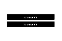 Catalog illustration of two black front door sill plates with Bullitt lettering.