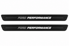 Catalogue illustration of two black Matte PRO front sill plates with the two-part italic FORD PERFORMANCE inscription illuminated on top. One decorative bar on either side and the edges remain unlit; no rear plates or exact dimensions pictured.