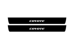 Catalog illustration of two black front door sill plates with Coyote lettering.