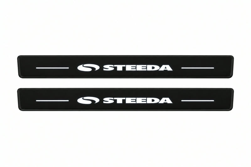 Catalog illustration of two front black Matte PRO LED door sill plates with illuminated Steeda lettering for Ford Mustang VI S550.