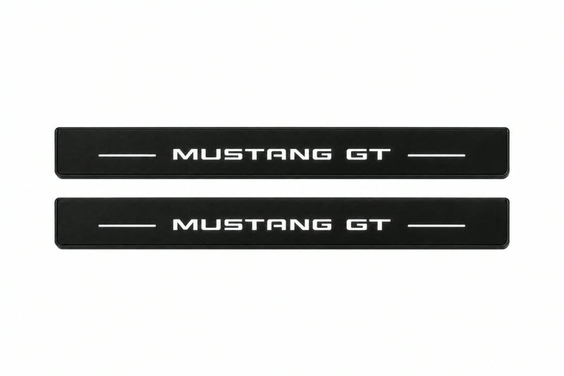 Catalog illustration of two front black Matte PRO LED door sill plates with illuminated Mustang GT lettering for Ford Mustang VII S650.