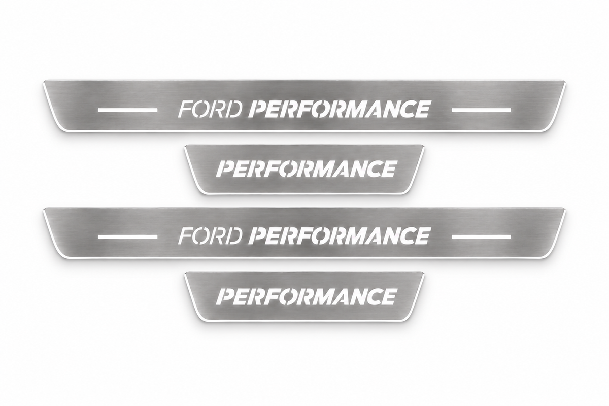 Product visualization: four Ford Focus FRONT+REAR, Ford Performance long plates and Performance short plates flat brushed stainless steel door sill plates with white LED artwork and edges, white background.