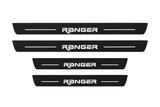 Catalog illustration of two front and two rear black Matte PRO door sill plates with CUSTOM RANGER lettering and horizontal lines illuminated on top; opaque unlit side edges. Final dimensions selected for Ford Ranger T6 during manufacture.