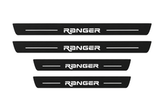 Catalog illustration of two front and two rear black Matte PRO door sill plates with CUSTOM RANGER lettering and horizontal lines illuminated on top; opaque unlit side edges. Final dimensions selected for Ford Ranger T6 during manufacture.