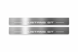 Product visualization: two exact original s650-mustang-gt flat Stainless front plates; all source artwork retained and actual LED edges white flat brushed stainless steel door sill plates with white LED artwork and edges, white background.