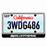 Ford WILDTRAK illuminated LED license plate badge with the shown artwork below an illustrative US plate; plate not included