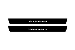 Catalog illustration of two black front door sill plates with Fusion lettering.