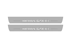 Catalog illustration of two long gray door sill plates with Brabus G900 lettering on a white background.