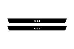 Catalog illustration of two black front door sill plates with GLI lettering.
