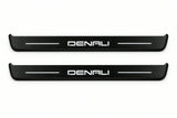 Catalogue illustration of two front black Matte PRO LED door sill plates with illuminated Denali lettering for GMC Canyon III GMT31; dimensions are selected during manufacture.