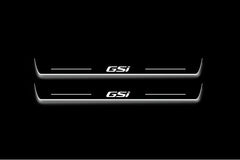 Two long door sill plates with GSi lettering and edges illuminated in white, straight-on view on a dark background.