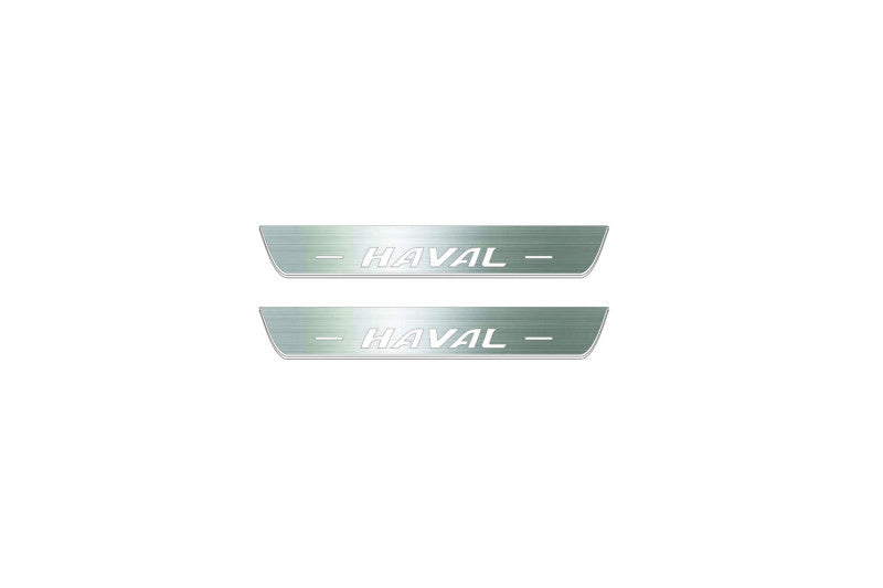 Two short silver-finished door sill plates with Haval lettering on a light background, straight-on view.