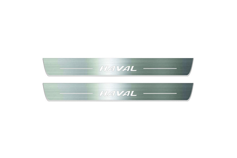 Two long silver-finished door sill plates with Haval lettering on a light background, straight-on view.