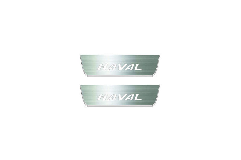 Two short silver-finished door sill plates with Haval lettering on a light background, straight-on view.