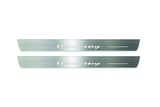 Two long silver-finished door sill plates with Hennessey lettering on a light background, straight-on view.