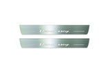 Two long silver-finished door sill plates with Hennessey lettering on a light background, straight-on view.
