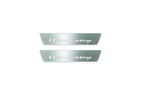Two short silver-finished door sill plates with Hennessey lettering on a light background, straight-on view.