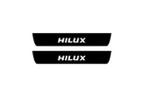 illuminated door sill protectors Toyota Hilux VIII 2015+ matte black coated stainless steel with Hilux logo