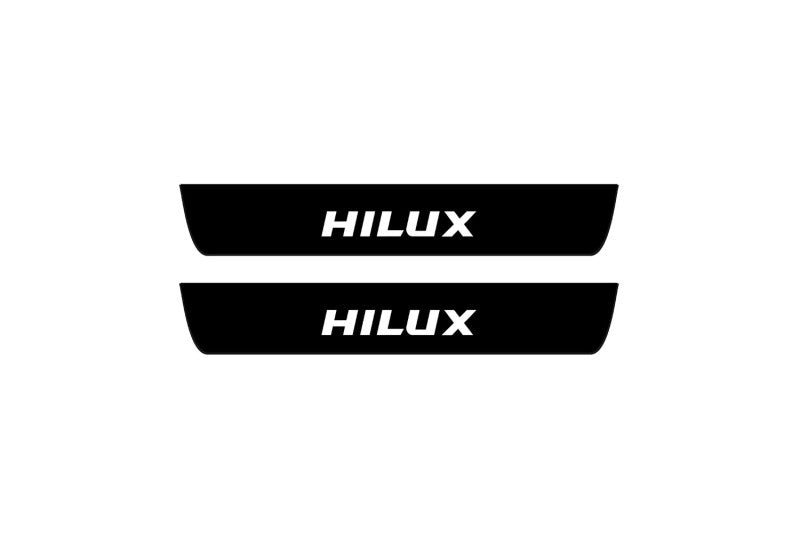 illuminated door sill protectors Toyota Hilux VIII 2015+ matte black coated stainless steel with Hilux logo