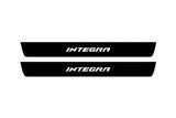 Catalogue illustration of two front black Matte PRO LED door sill plates with illuminated Integra lettering for Honda Integra; dimensions are selected during manufacture.