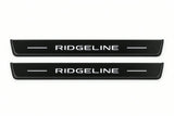 Catalogue illustration of two front black Matte PRO LED door sill plates with illuminated Ridgeline lettering for Honda Ridgeline YK2; dimensions are selected during manufacture.
