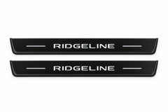Catalogue illustration of two front black Matte PRO LED door sill plates with illuminated Ridgeline lettering for Honda Ridgeline YK2; dimensions are selected during manufacture.