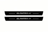 Catalogue illustration of two front black Matte PRO LED door sill plates with illuminated Elantra GT lettering for Hyundai Elantra GT; dimensions are selected during manufacture.