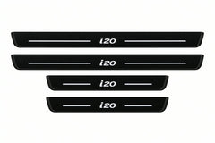 Shared catalogue illustration of two long front and two shorter rear black Matte PRO plates with illuminated i20 lettering and unlit edges. FRONT option contains only front pair; Hyundai i20 PB dimensions are selected during manufacture.