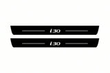 Catalogue illustration of two front black Matte PRO LED door sill plates with illuminated i30 lettering for Hyundai i30 III; dimensions are selected during manufacture.