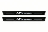 Catalogue illustration of two front black Matte PRO LED door sill plates with illuminated N Line Performance lettering for Hyundai Ioniq 5; dimensions are selected during manufacture.