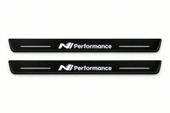Catalogue illustration of two front black Matte PRO LED door sill plates with illuminated N Line Performance lettering for Hyundai Ioniq 5; dimensions are selected during manufacture.