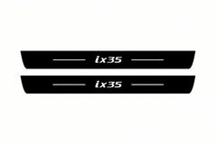 Catalogue illustration of two front black Matte PRO LED door sill plates with illuminated ix35 lettering for Hyundai ix35; dimensions are selected during manufacture.