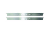 Two long silver-finished door sill plates with Ibiza in block lettering lettering on a light background, straight-on view.