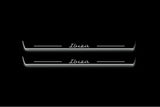 Two long door sill plates with Ibiza in script lettering and edges illuminated in white, straight-on view on a dark background.