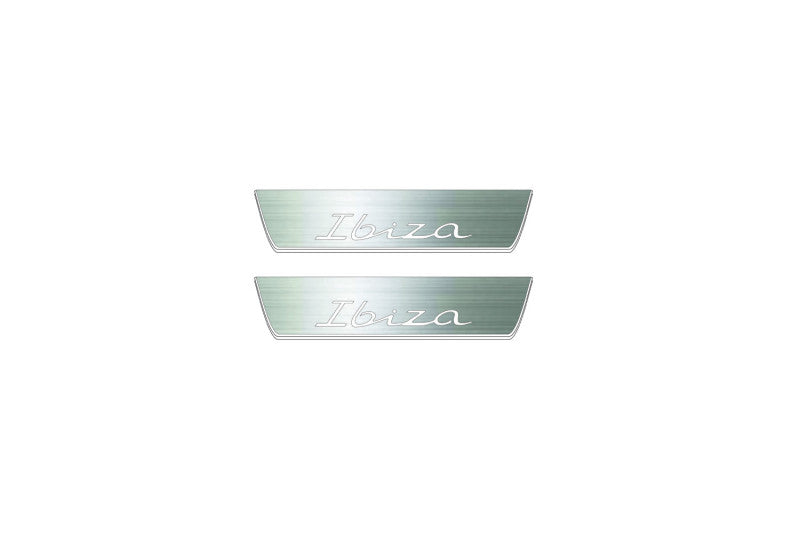 Two short silver-finished door sill plates with Ibiza in script lettering on a light background, straight-on view.