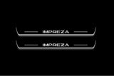 Two long door sill plates with Impreza lettering and edges illuminated in white, straight-on view on a dark background.