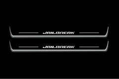 Two long door sill plates with Jailbreak lettering and edges illuminated in white, straight-on view on a dark background.