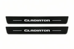 Catalogue illustration of two front black Matte PRO LED door sill plates with illuminated Gladiator lettering for Jeep Gladiator JT; dimensions are selected during manufacture.