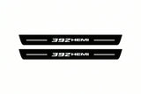 Catalogue illustration of two front black Matte PRO LED door sill plates with illuminated 392 HEMI lettering for Jeep Grand Cherokee WK2; dimensions are selected during manufacture.