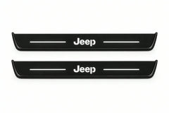 Catalogue illustration of two front black Matte PRO LED door sill plates with illuminated Jeep lettering for Jeep Grand Cherokee WL; dimensions are selected during manufacture.