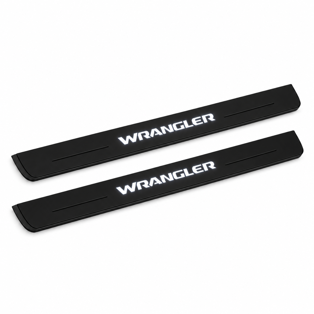 Catalogue illustration of two black Matte PRO front door sill plates with white WRANGLER lettering illuminated only on top. Edges are unlit; rear plates for FRONT+REAR are not pictured. Final dimensions are selected for Wrangler JL during manufacture.