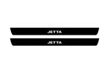 illuminated door sill protectors Volkswagen Jetta VI 2010+ in matte black coated stainless steel with Jetta logo