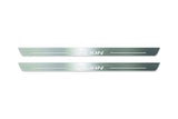 Two long silver-finished door sill plates with Jolion lettering on a light background, straight-on view.